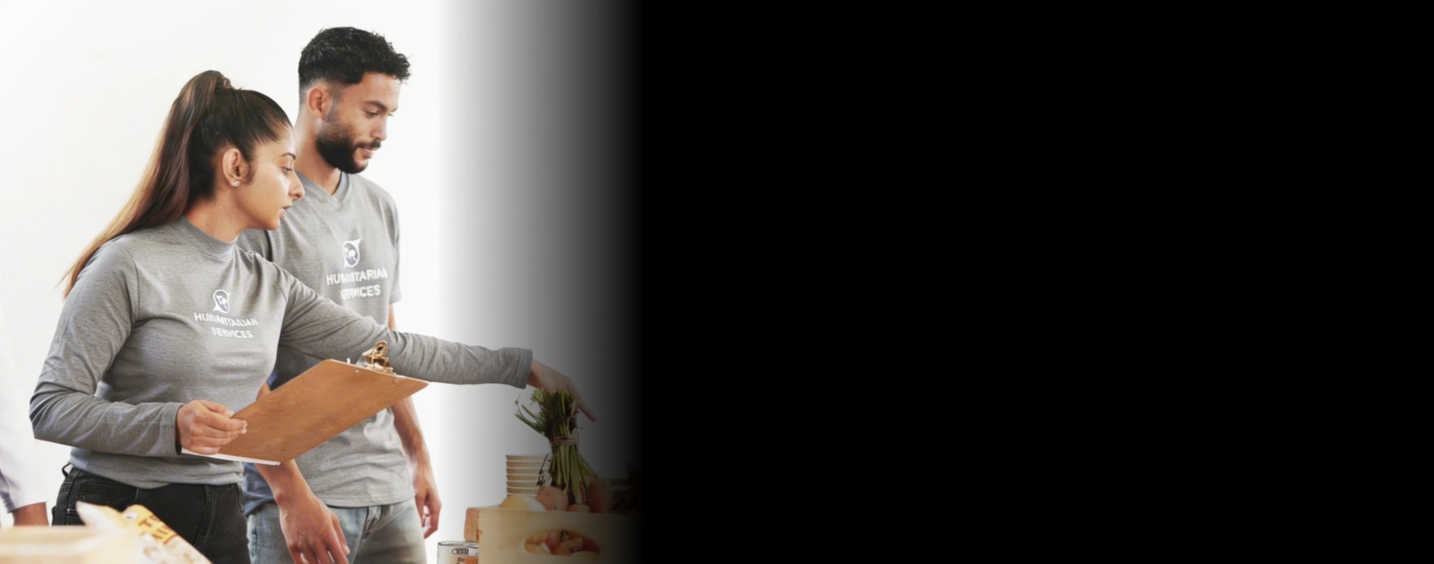 Non-profit team members standing together with hands joined