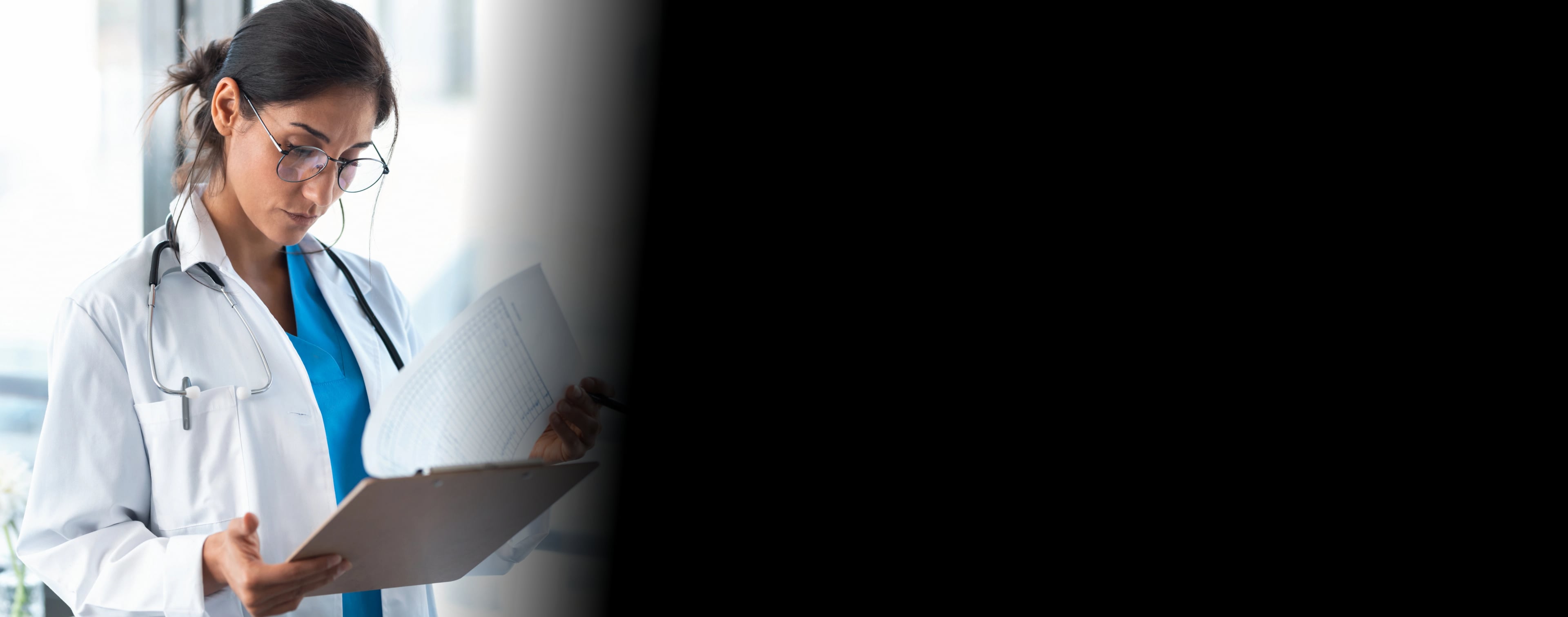 Doctor reviewing compliance documents